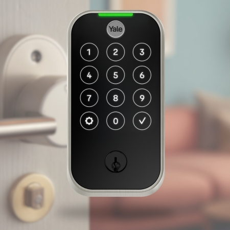 Yale Assure smart lock with illuminated keypad mounted on a door